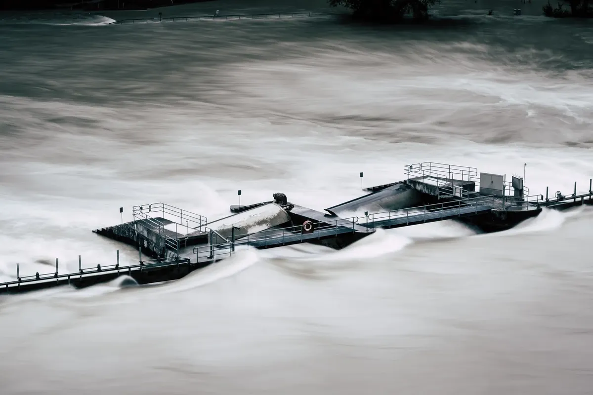 An aerial view of a structure overwhelmed by a river flood in Bern, Switzerland.